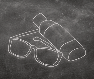 Chalkboard drawing of sunglasses and a bottle of sunscreen